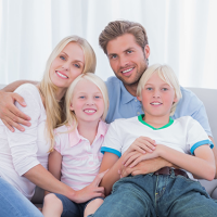 family-four-couch-smiling-sitting-boy-girl-123rF-26731509_xl.png